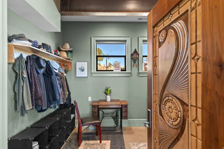 Crafted wooden entry door with intricate carvings
