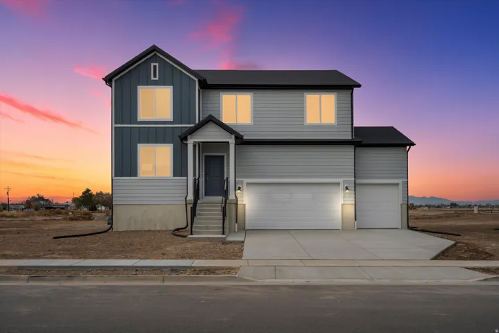 **DISCLAIMER** Exterior elevation may vary. Contemporary two-story residence featuring a striking combination of board and batten siding and horizontal panel siding