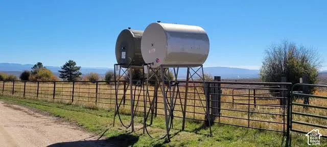 Two elevated cylindrical storage tanks on metal stands