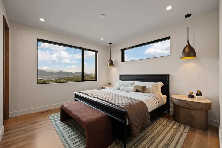 Expansive windows provide abundant natural illumination and highlight the scenic mountain landscape