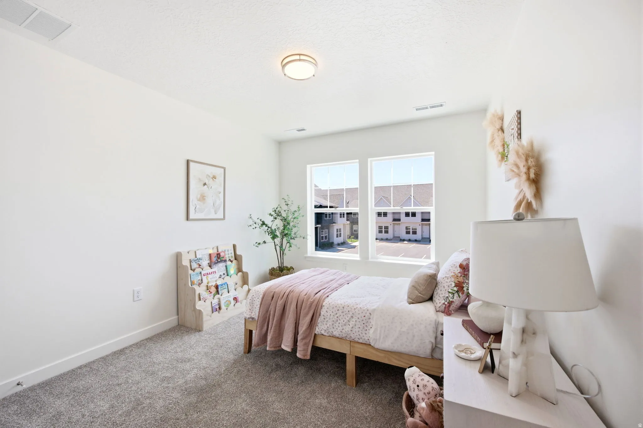 Bedroom featuring twin windows, light-colored walls, recessed lighting, and grey carpeting
