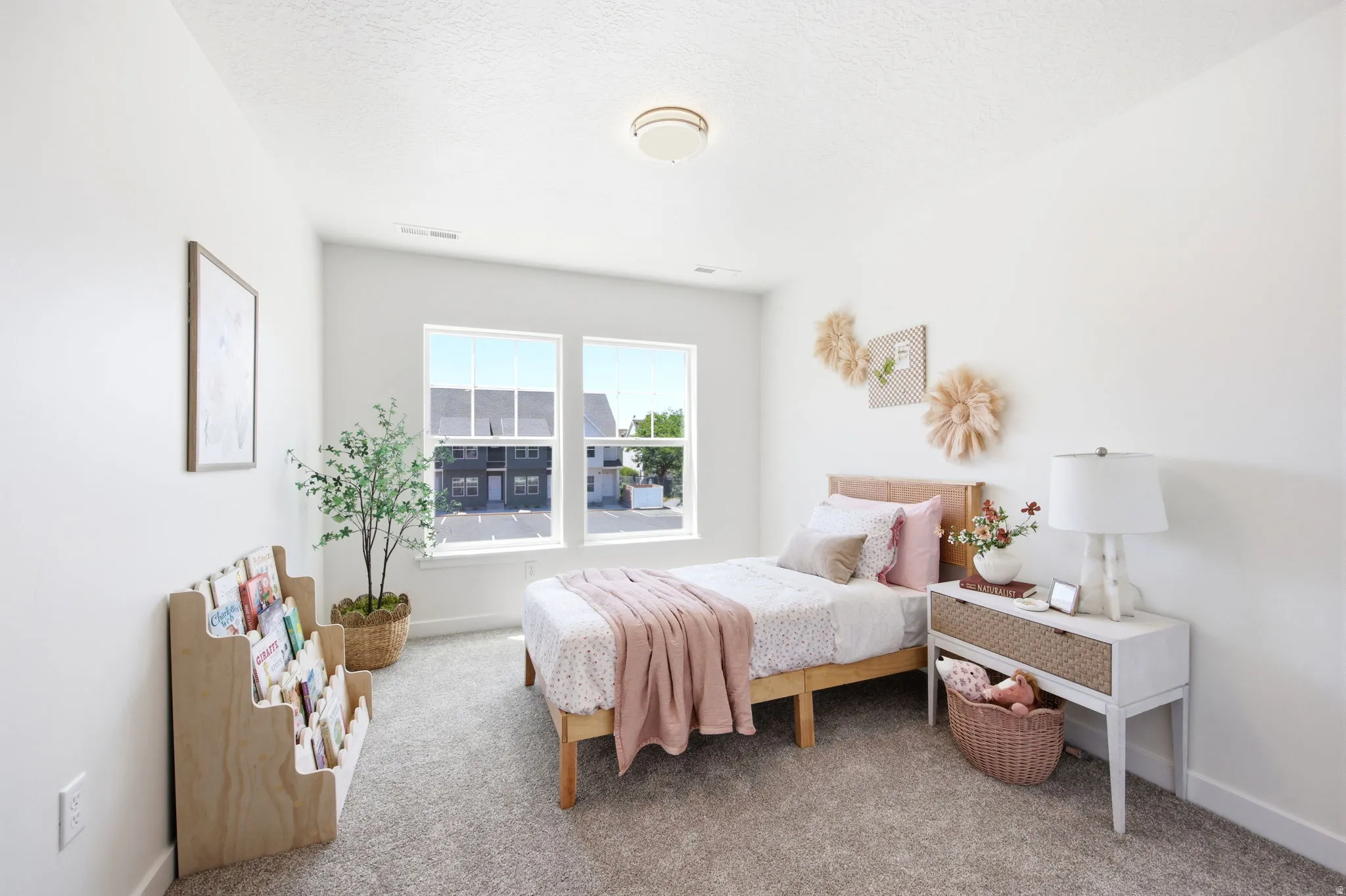 Bright room featuring twin windows and neutral wall tones
