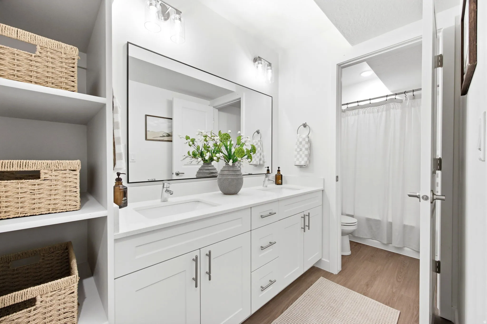 Dual vanity with undermount sinks and white shaker cabinetry
