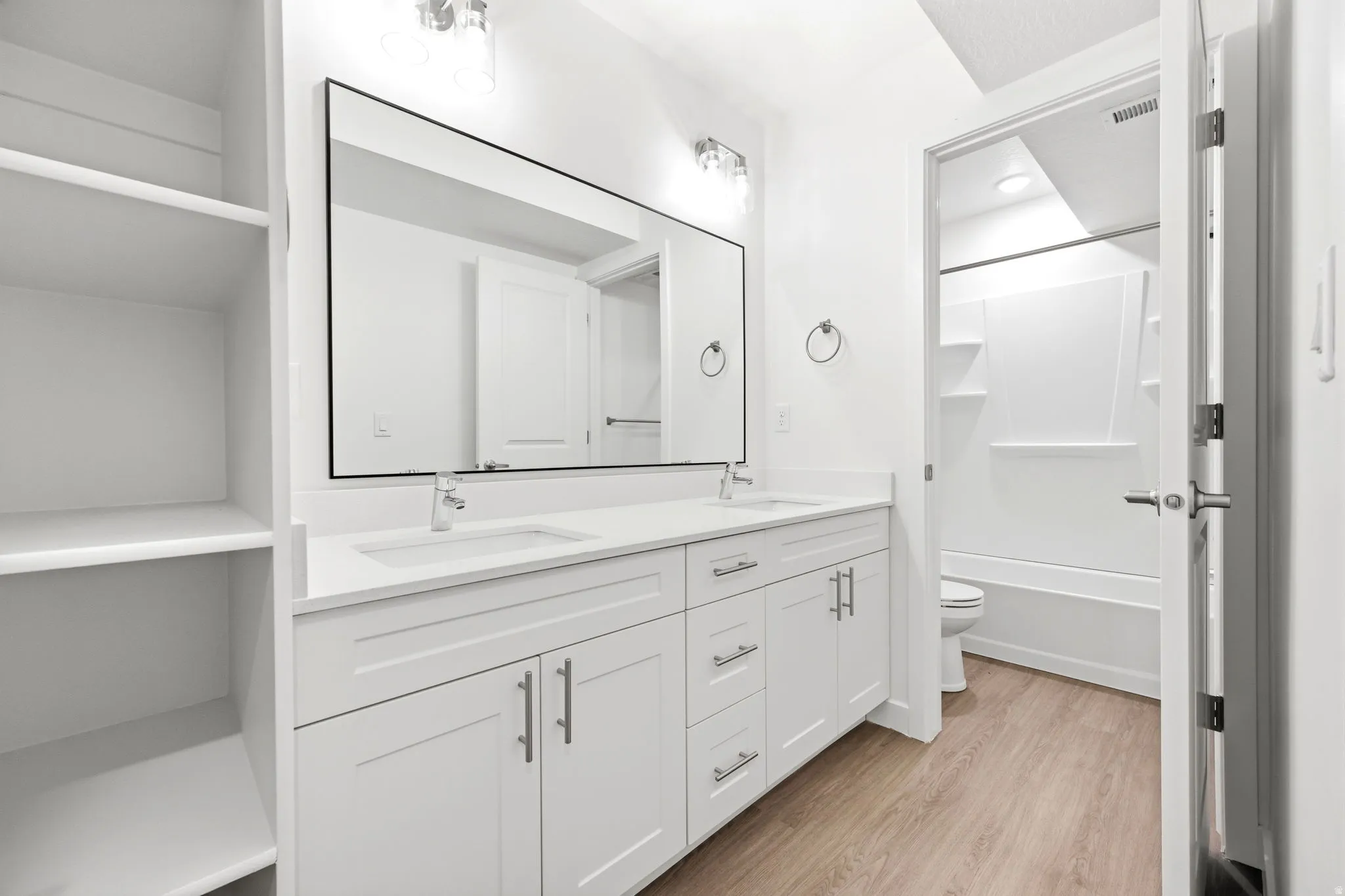 Dual vanity with quartz countertops and undermount sinks