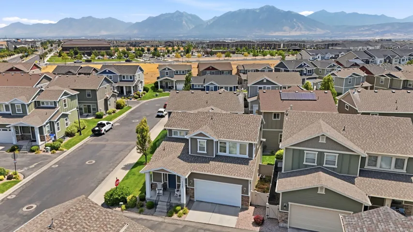 Aerial perspective showcasing a residential community with a mountain backdrop