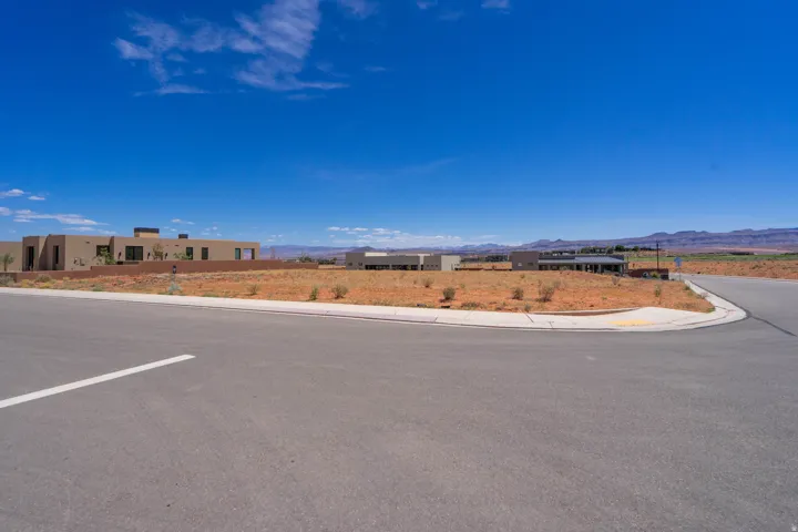 Expansive undeveloped lot presenting clear land and a paved street