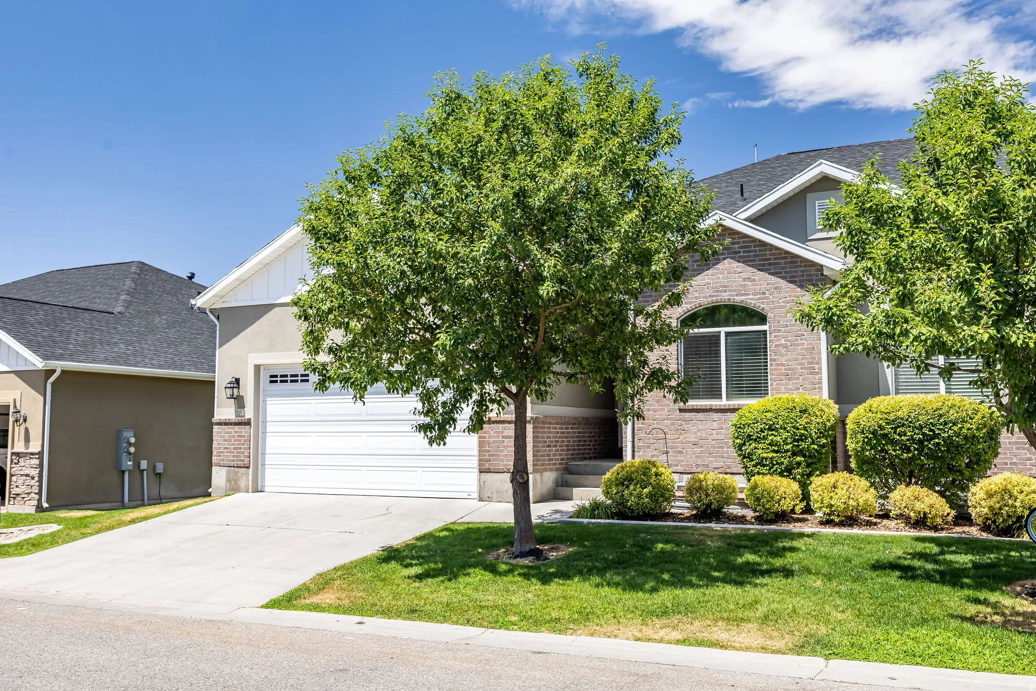 Brick and stucco exterior with white trim details