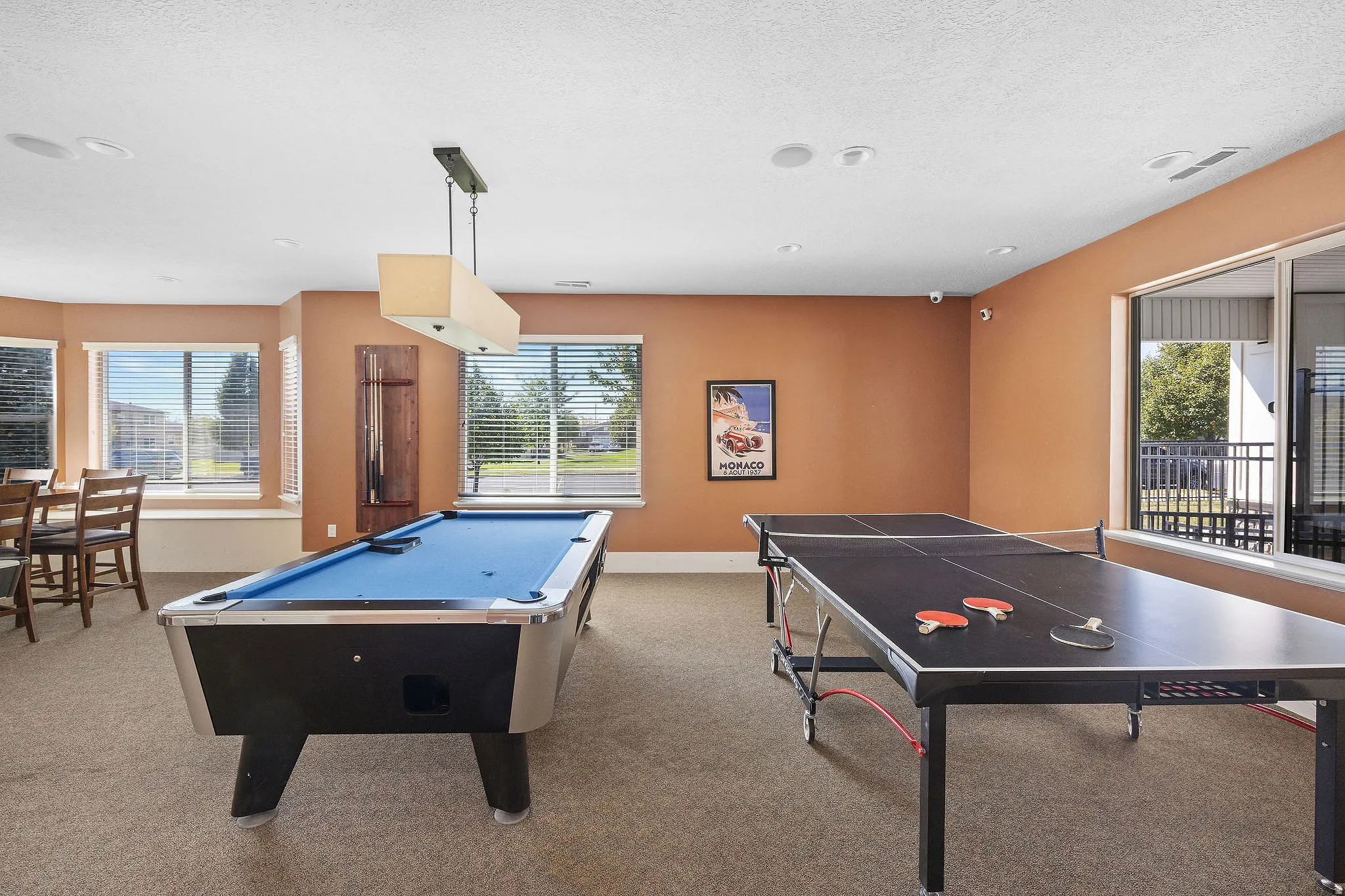 Recreational room featuring a billiard table and a ping pong table in clubhouse