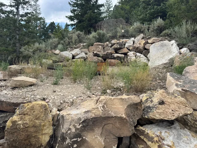 Natural rock outcroppings with a variety of stone sizes, textures, and earth tones