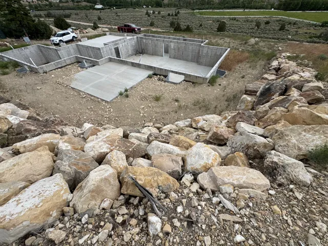 Concrete foundation with multiple sections and poured concrete pads