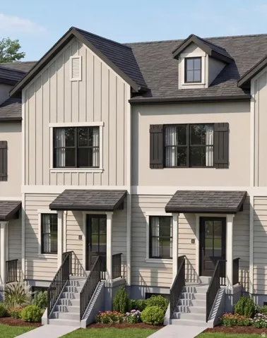 Contemporary townhome exterior featuring light-colored vertical siding and horizontal lap siding