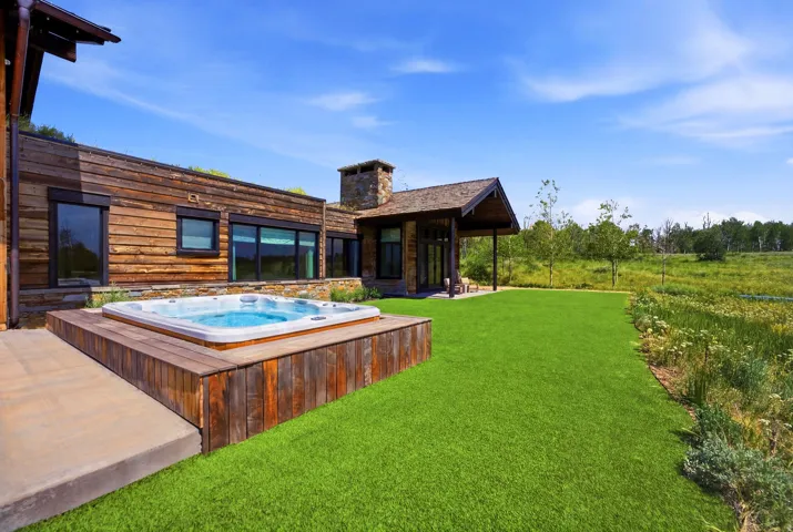 Contemporary exterior featuring natural wood siding and stone accents