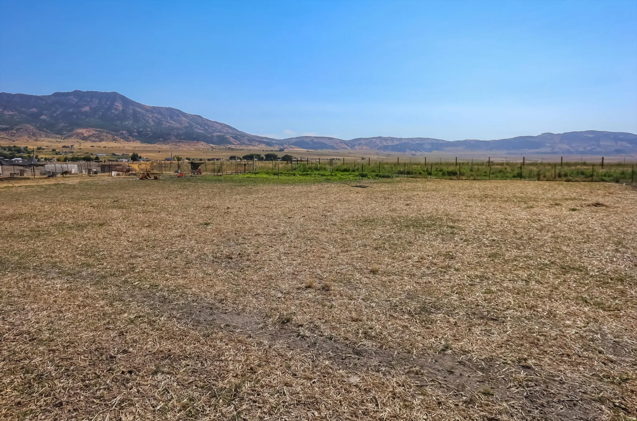 Expansive undeveloped lot with distant mountain backdrop