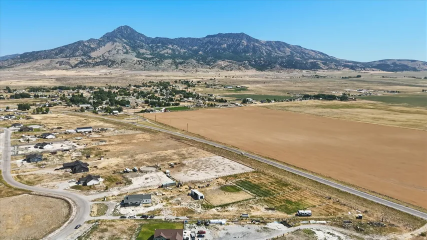 Expansive rural landscape with a prominent mountain range backdrop
