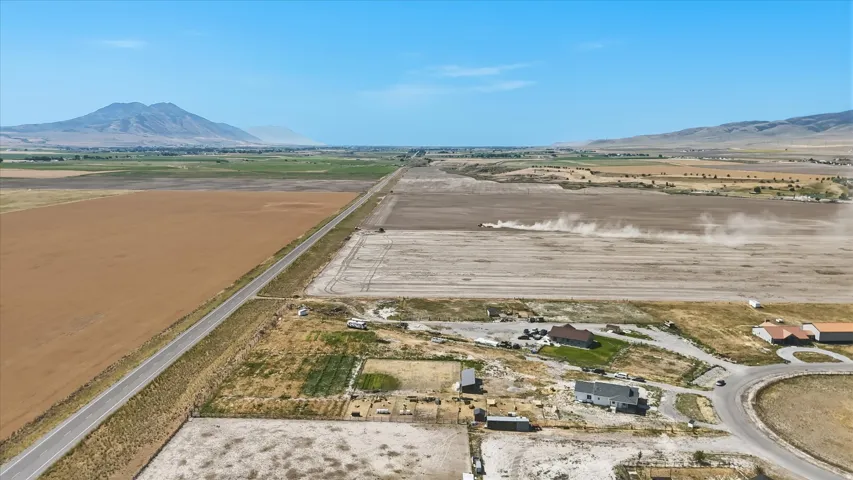 Expansive land parcels with clear skies and distant mountain ranges