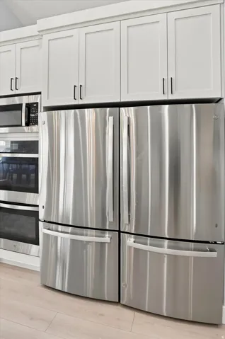 Stainless steel French door refrigerator with bottom freezer drawers
