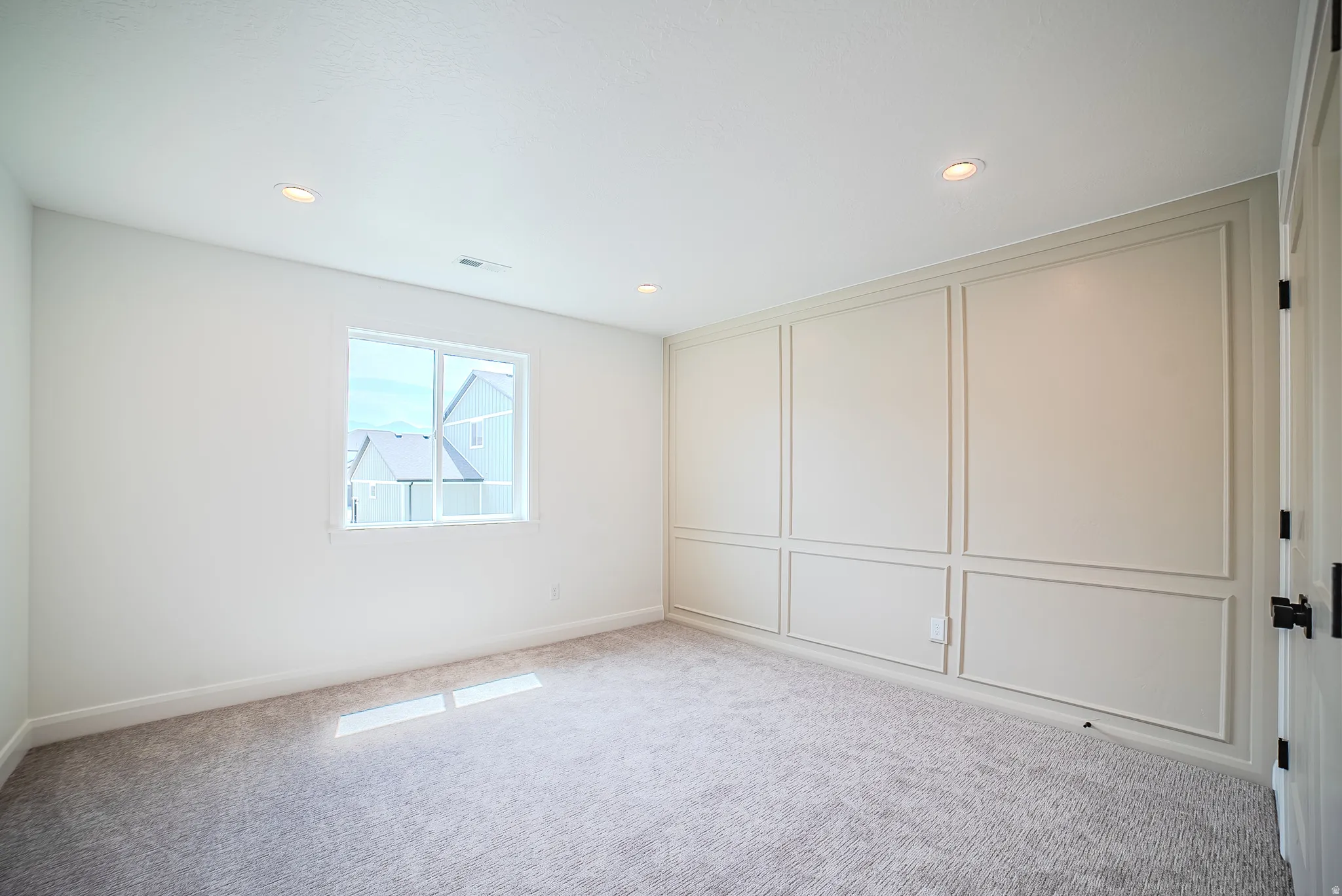 Room with recessed lighting, a single window, and plush carpet flooring