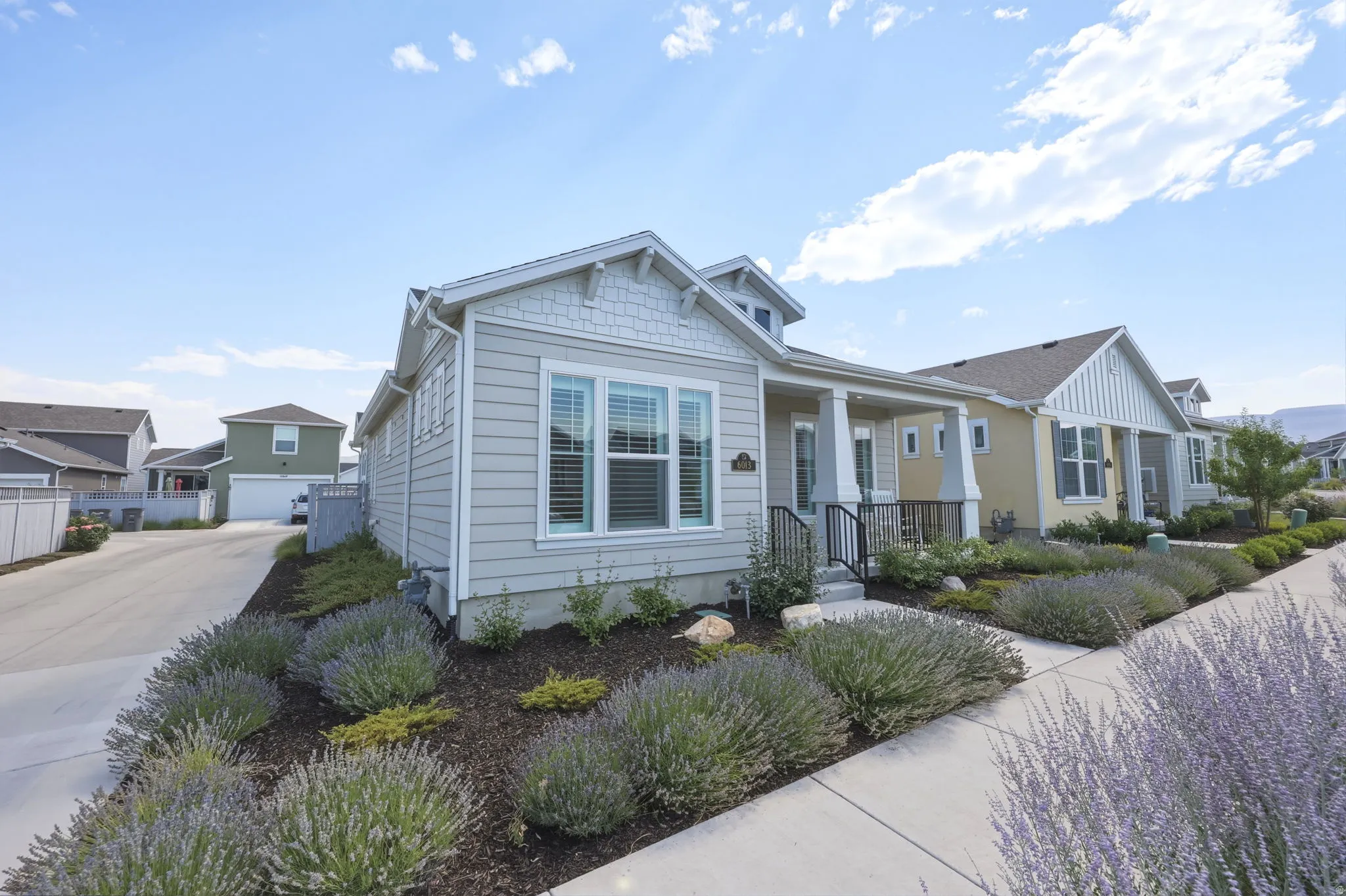 Light gray siding exterior with white trim.