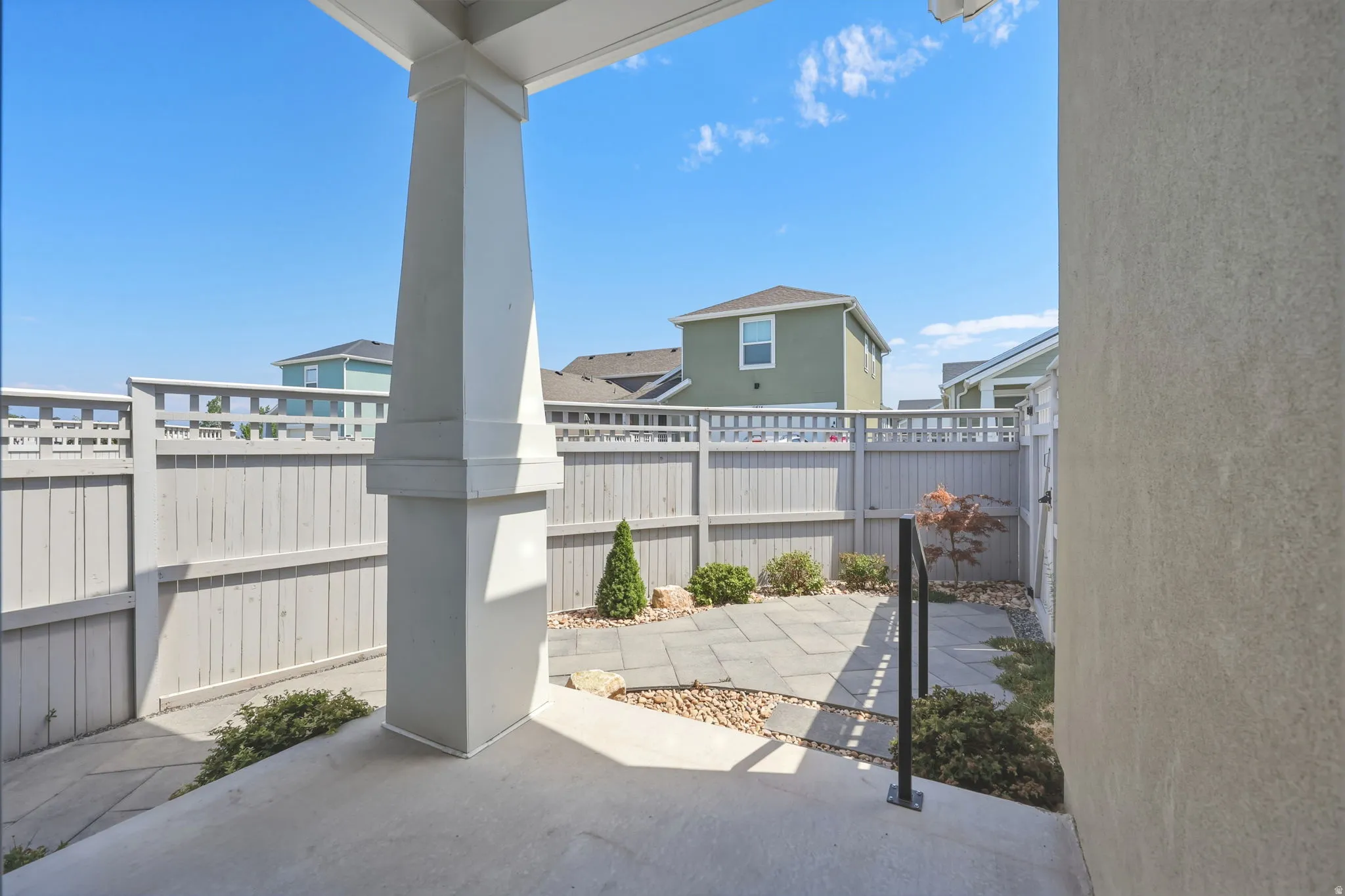 Patio with safety hand rail.