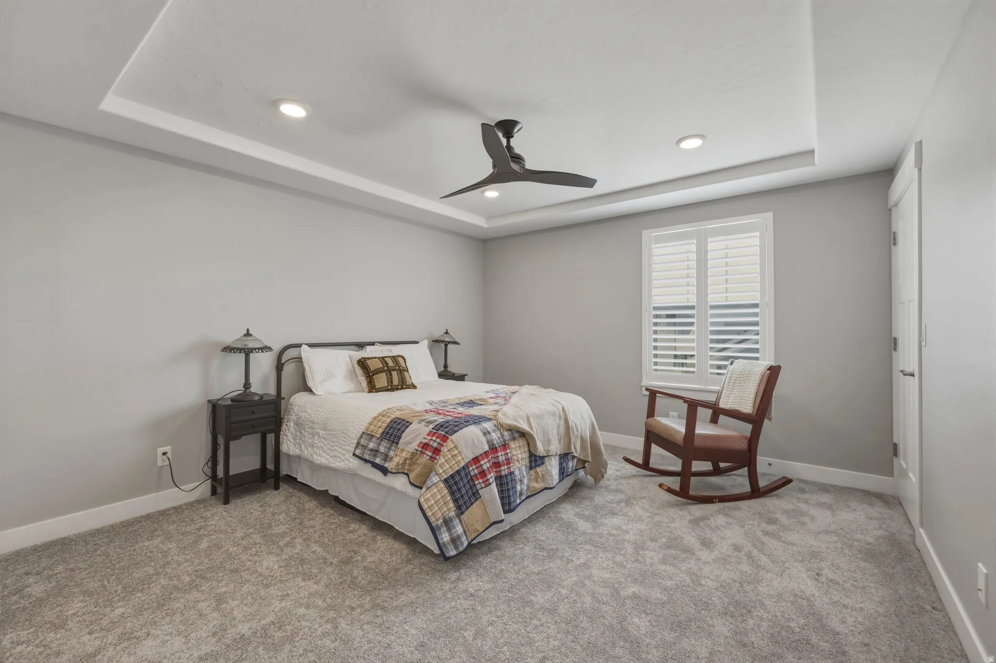 Spacious third room featuring a coffered ceiling with recessed lighting and a ceiling fan