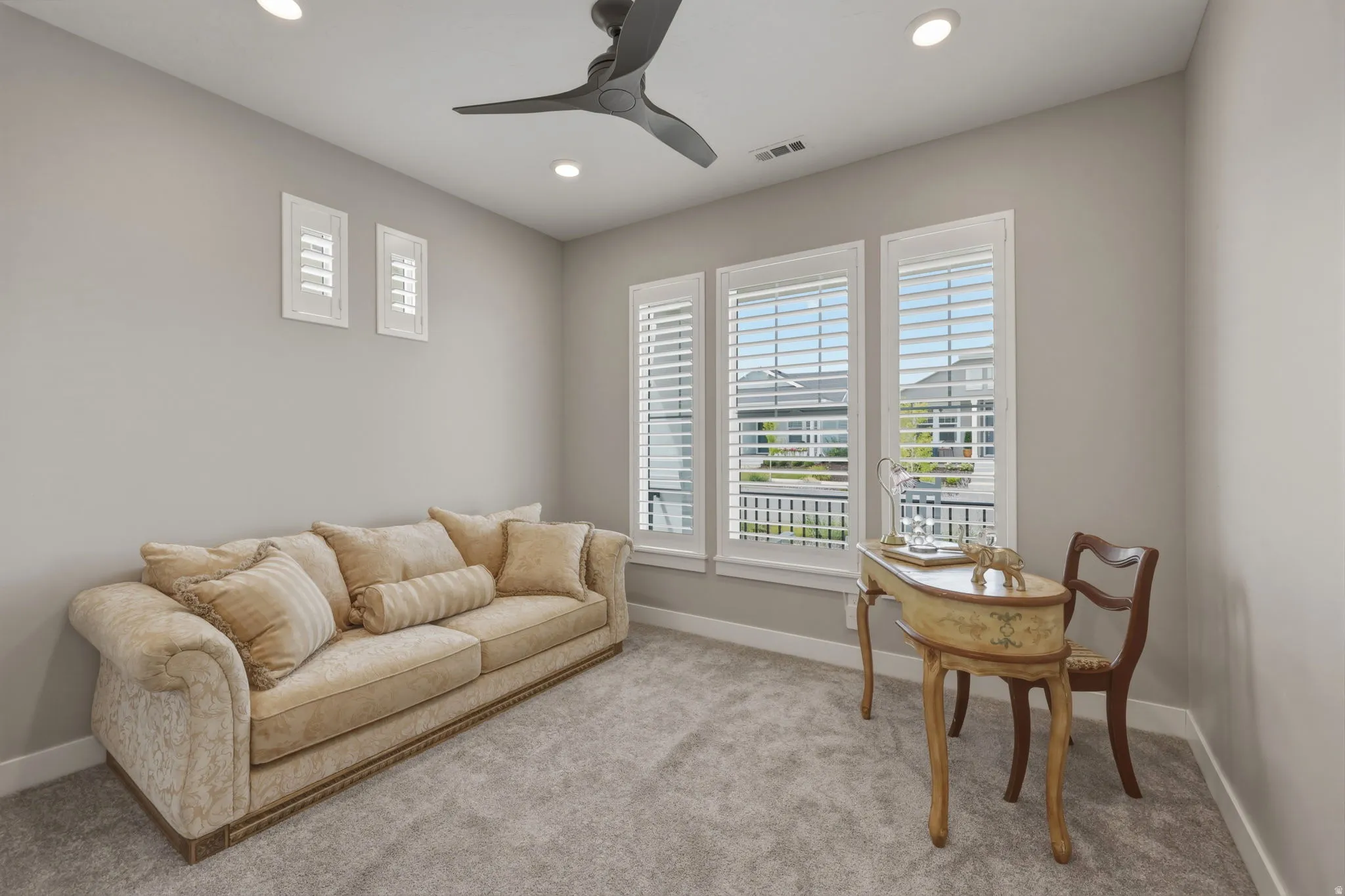 This versatile second bedroom can be used as a guest room, office or hobby space. Includes carpeting, recessed lighting and a ceiling fan.