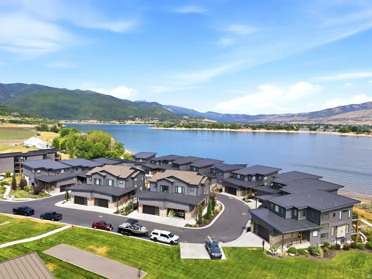Modern residential development featuring multi-story structures with dark facades and complementary roofing