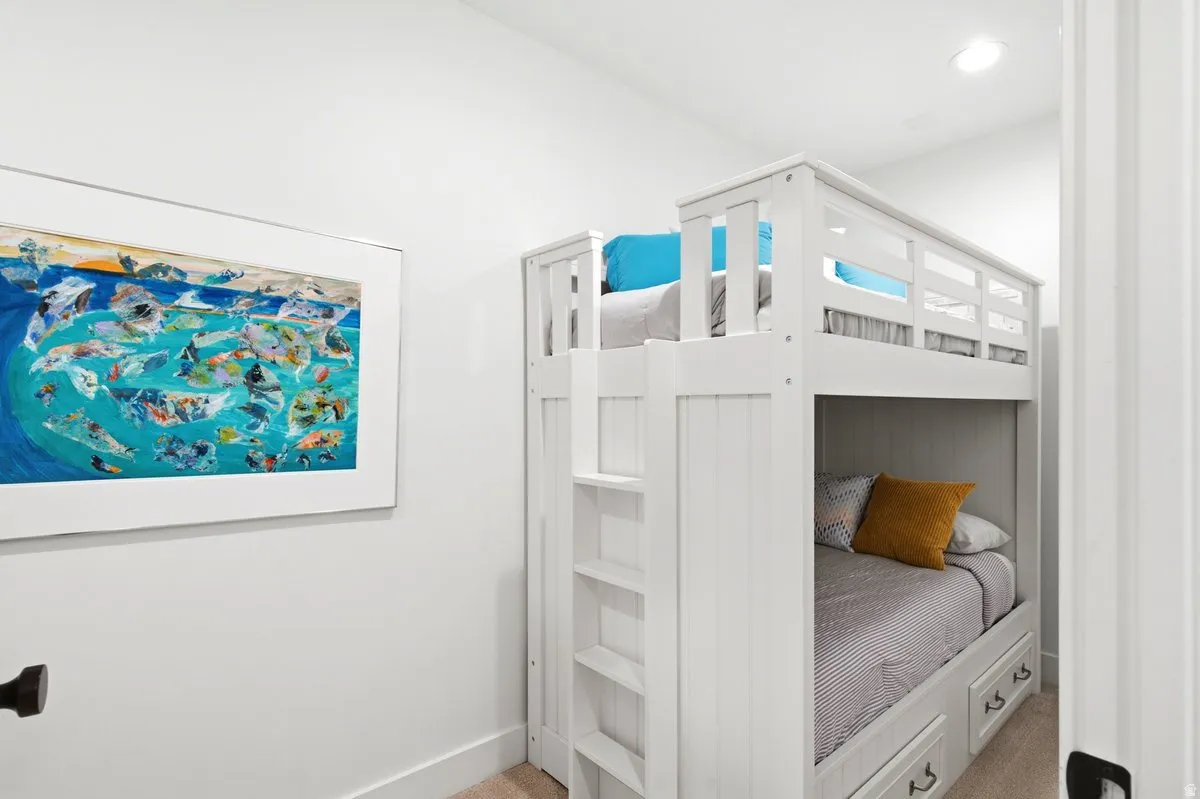 White bunk bed with built-in ladder and storage drawers