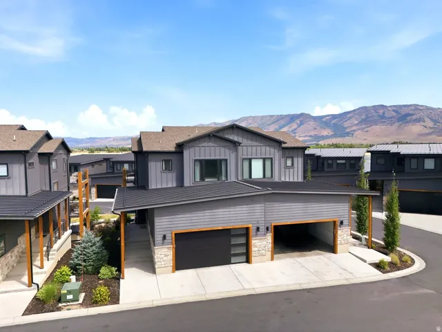 Modern gray exterior featuring board-and-batten siding and stone accents