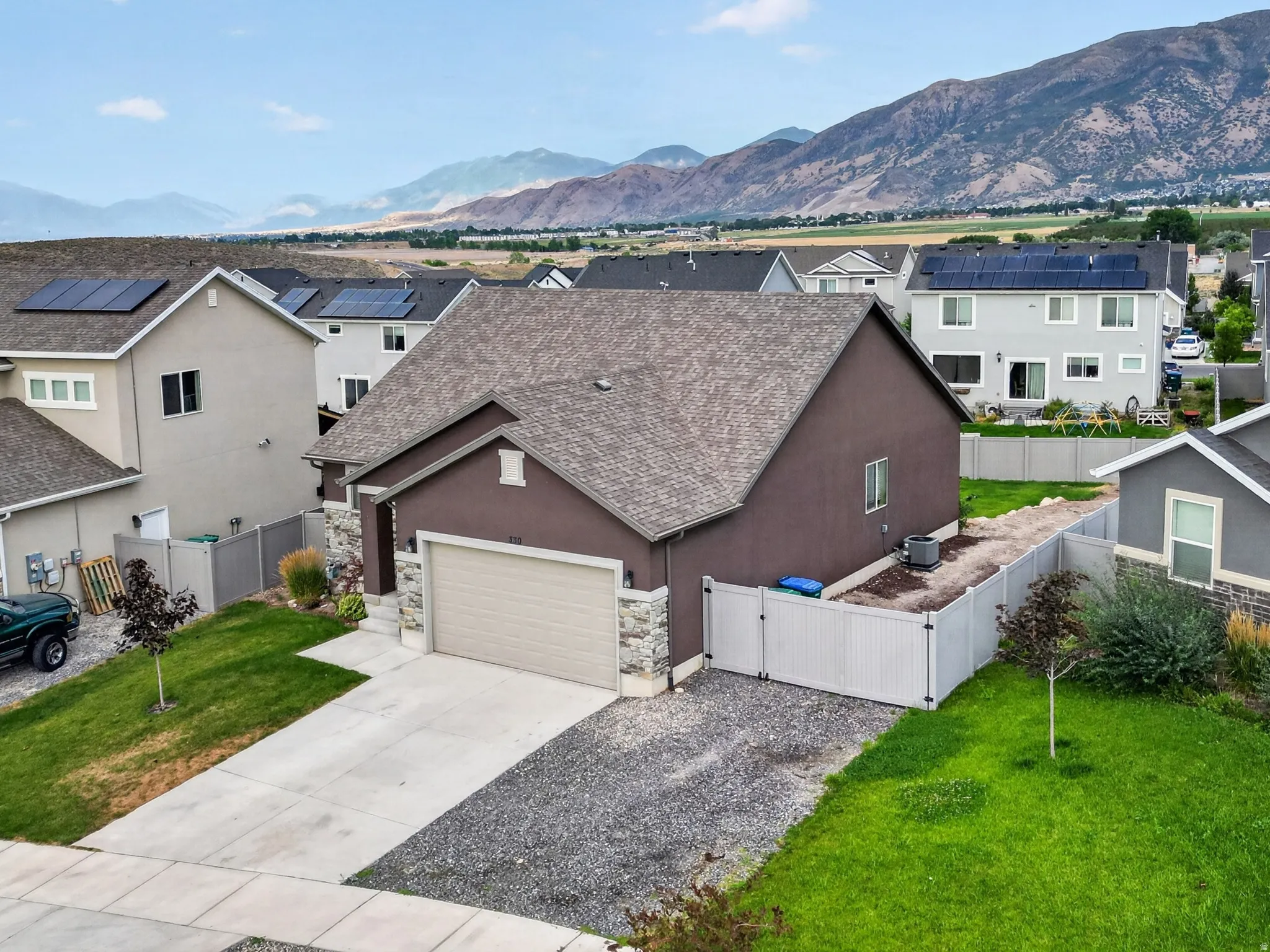 Stucco exterior with an attached two-car garage