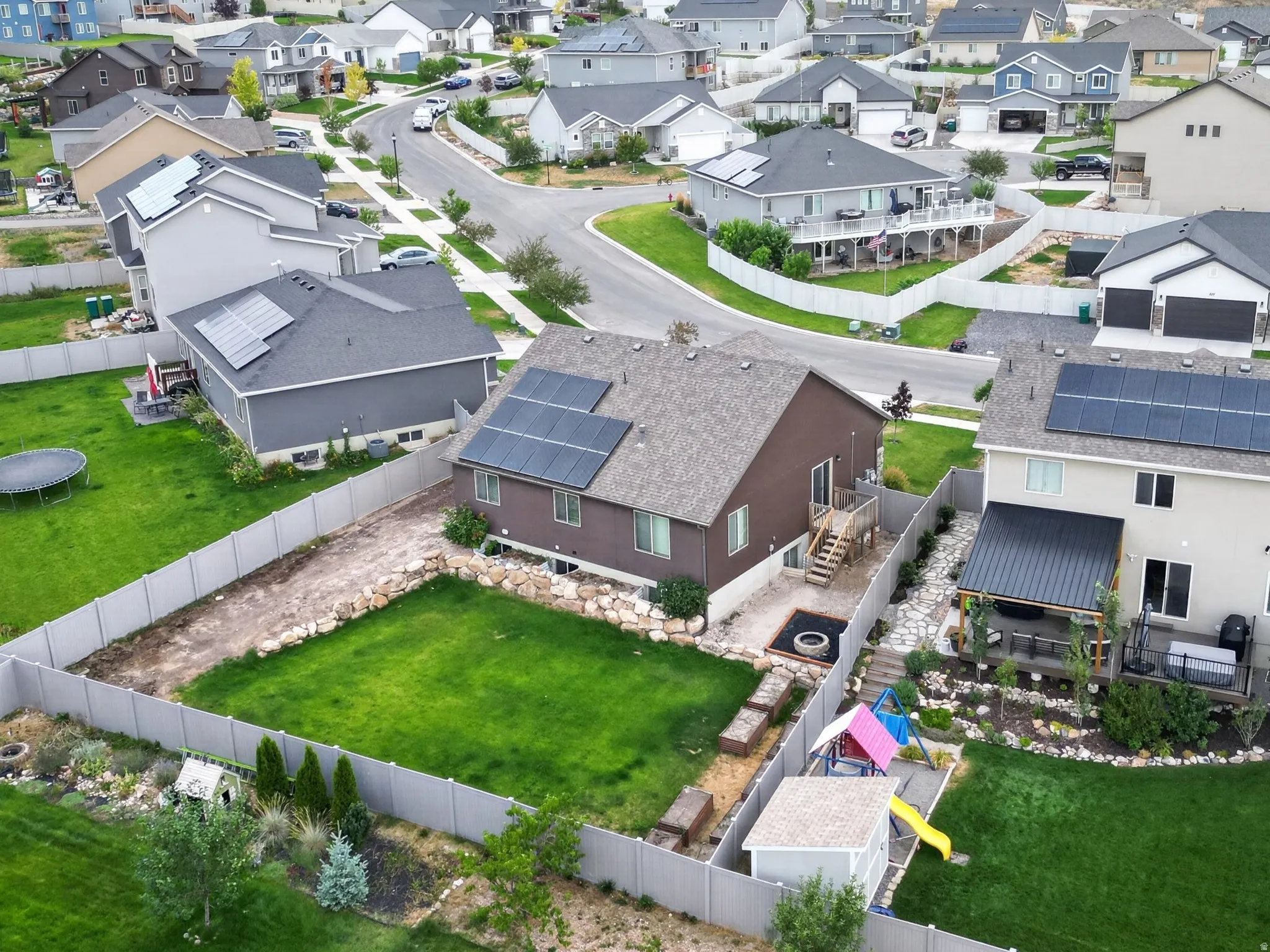 Residential neighborhood featuring varied architectural styles and a mountain backdrop