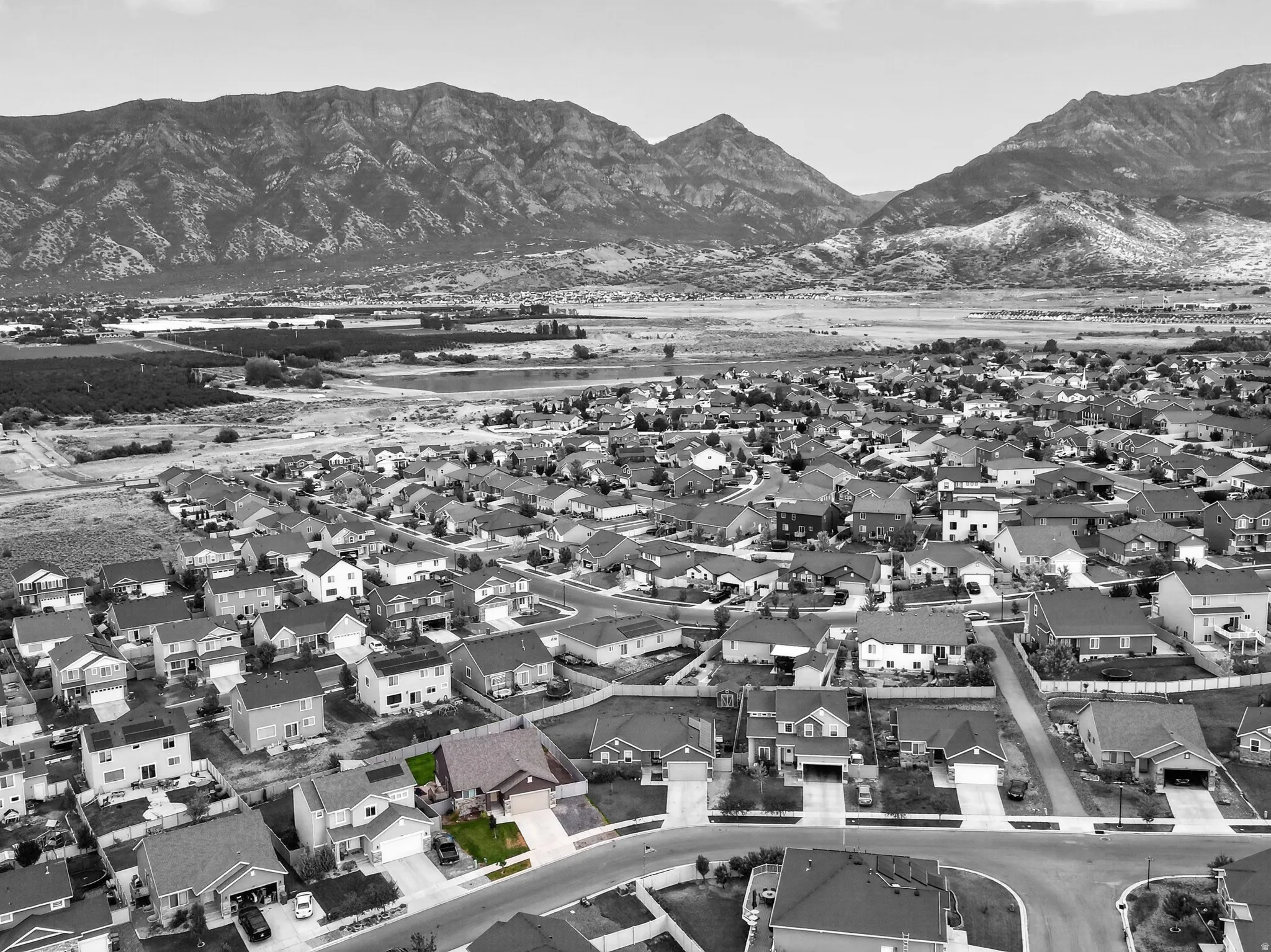 Residential neighborhood set against a mountain backdrop