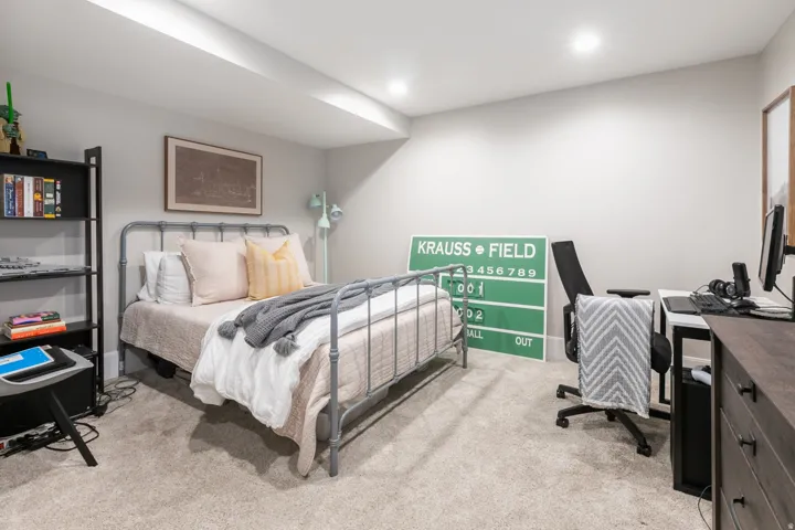 Carpeted room featuring recessed lighting, a built-in ceiling soffit, and painted walls