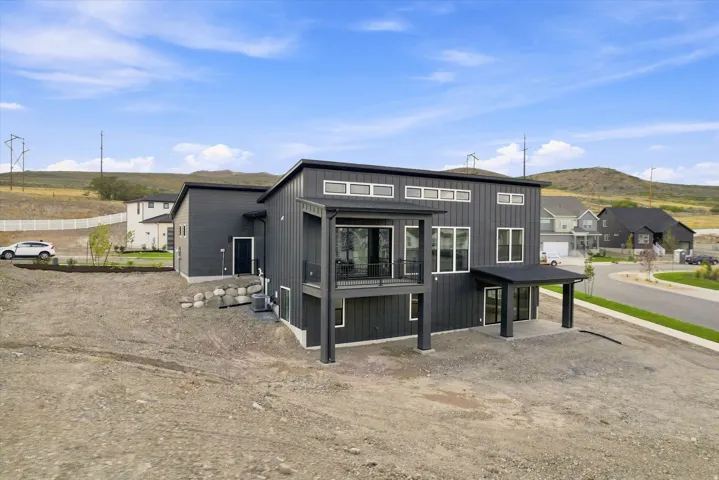 Modern architectural design featuring dark siding