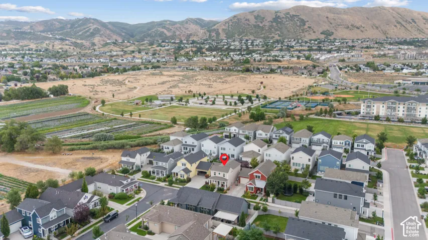 Aerial perspective showcasing a residential neighborhood with surrounding open spaces