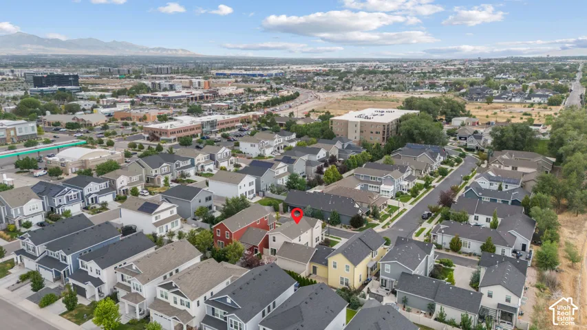 Aerial overview of a residential development featuring varied architectural styles and private garages