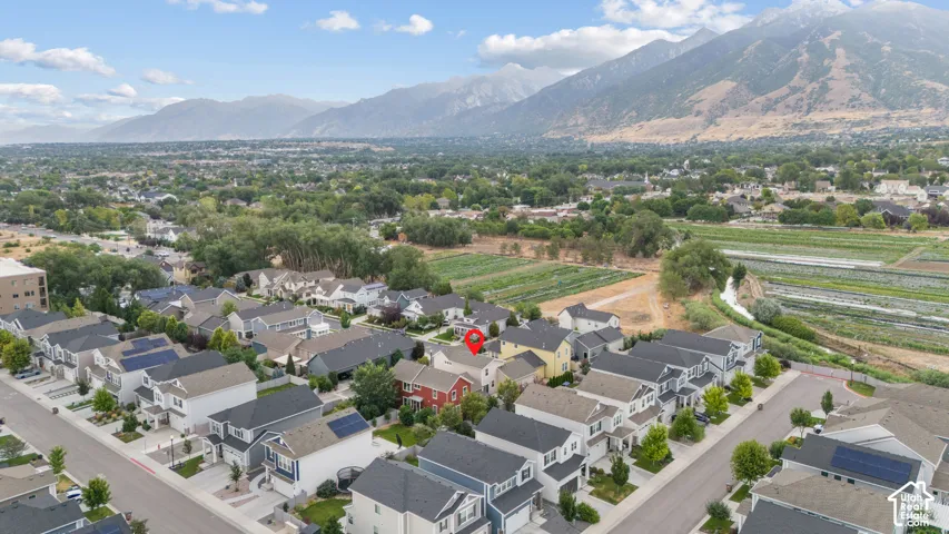 Aerial perspective of a developed residential area with mountain backdrop