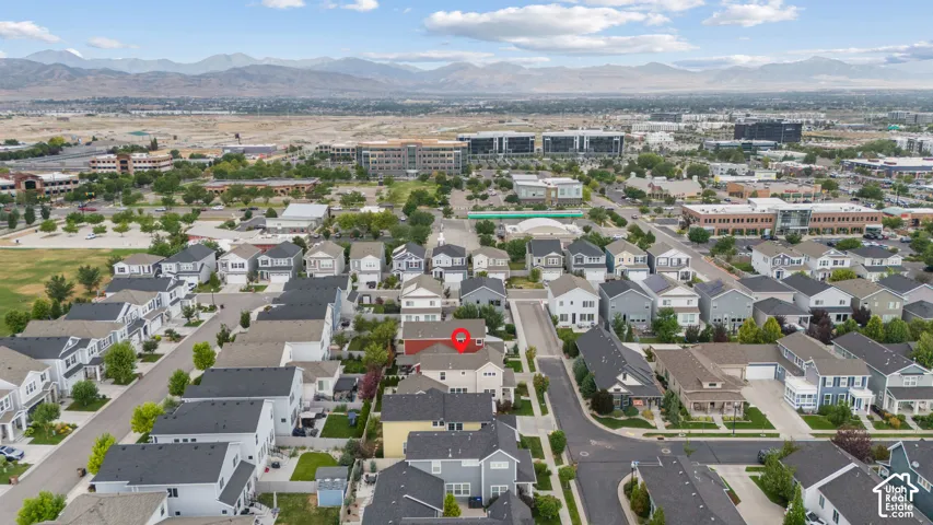Residential neighborhood featuring a variety of home styles, paved streets, and mature landscaping