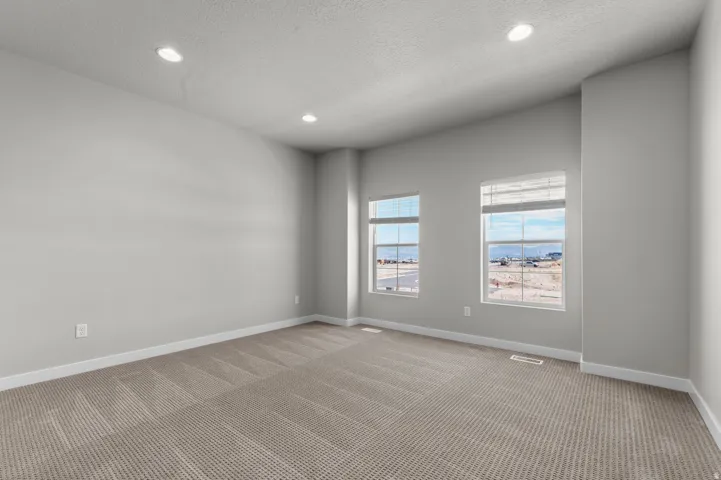 Recessed ceiling lighting illuminates the space