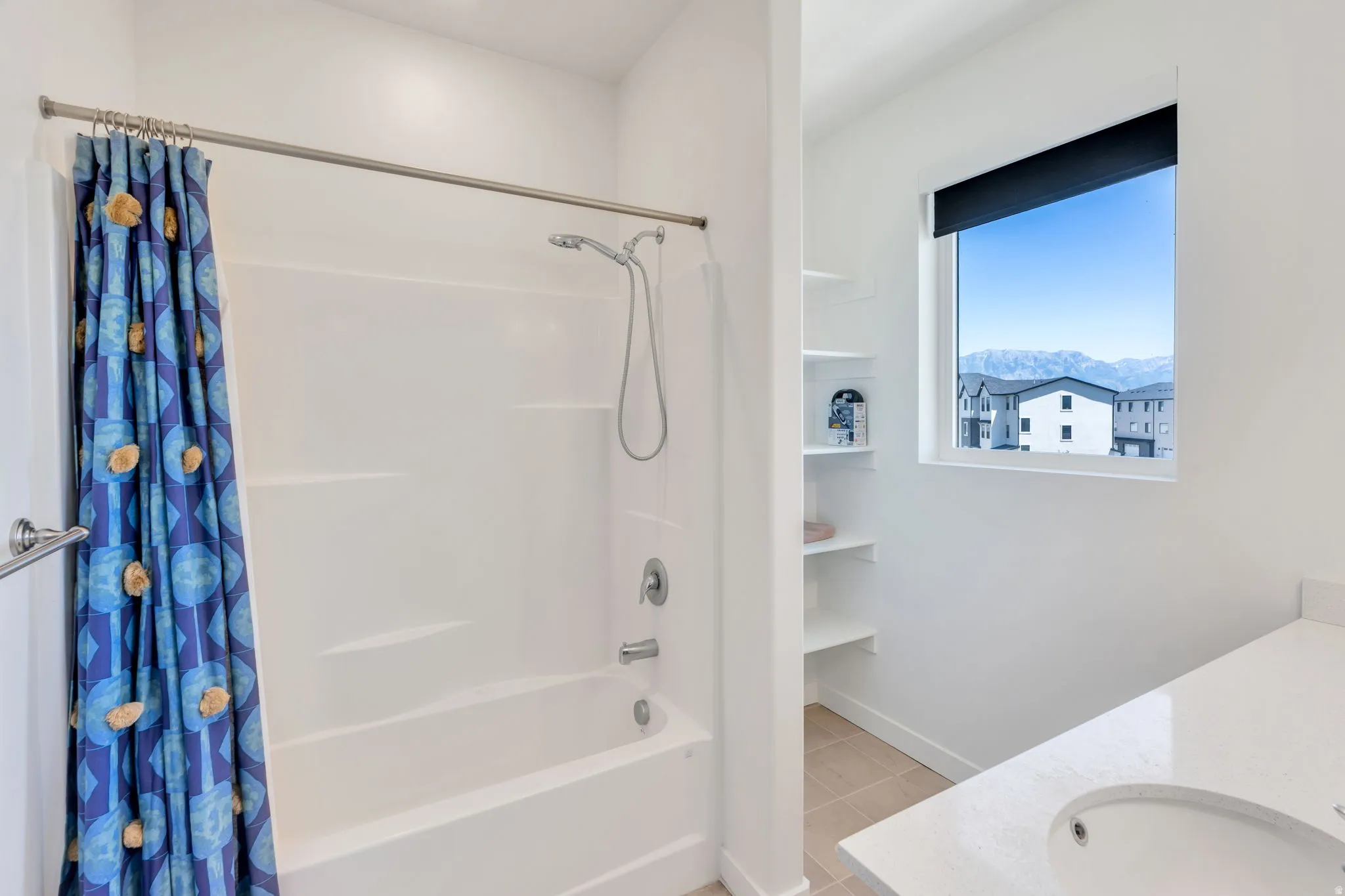 White tub/shower combination with a single handle faucet
