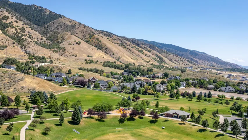 Residential community nestled against a mountainous backdrop