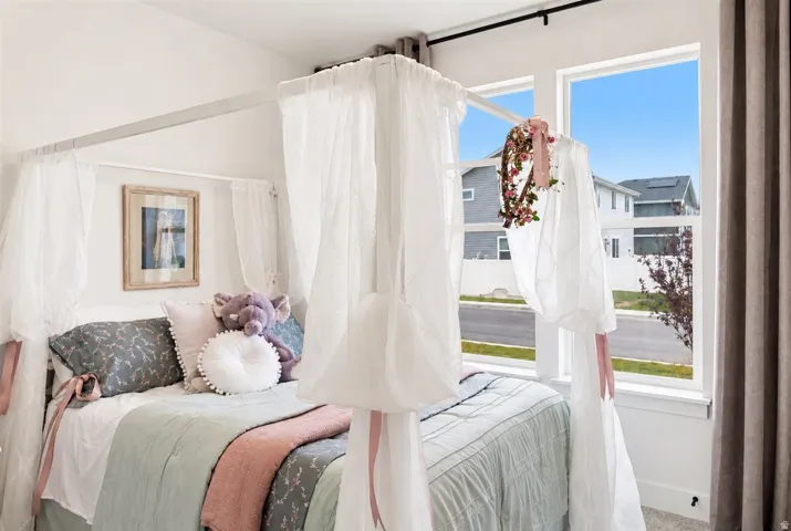 Room featuring bright white walls and a large window with white trim