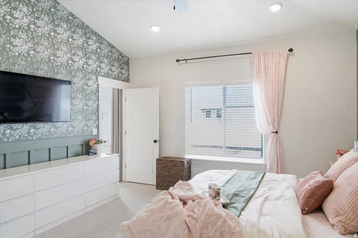 Feature wall with botanical-patterned wallpaper and paneling