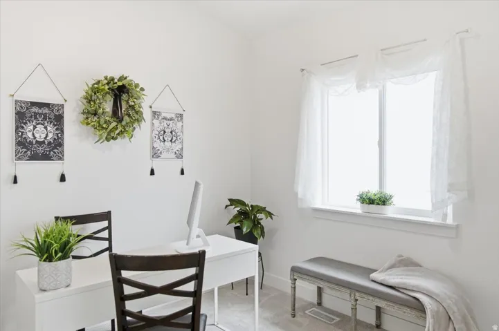 White walls and light-toned flooring create a bright interior