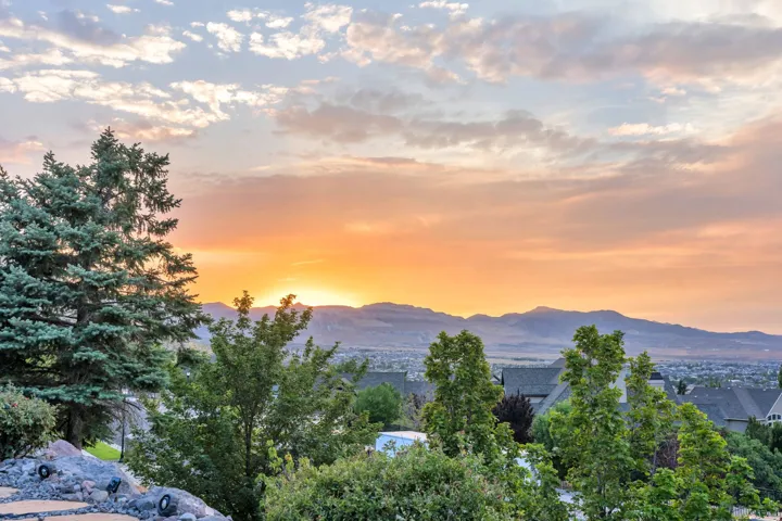 Expansive mountain scenery with residential rooftops below