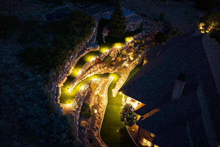 Extensive terraced hardscaping with integrated accent lighting