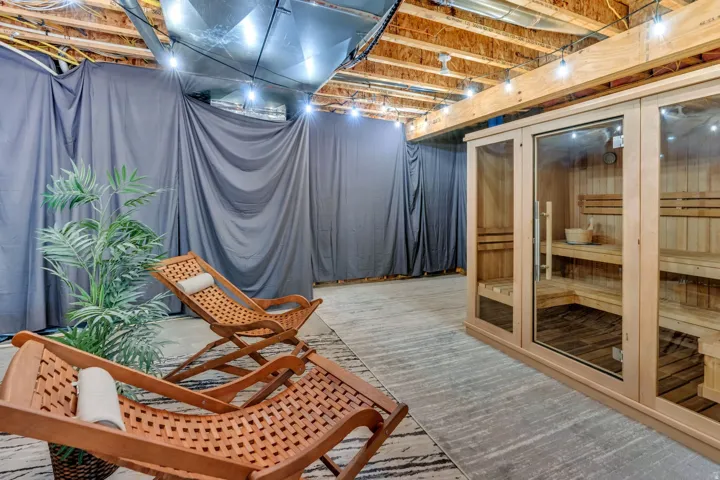 Built-in sauna featuring a glass door and wood-slat interior
