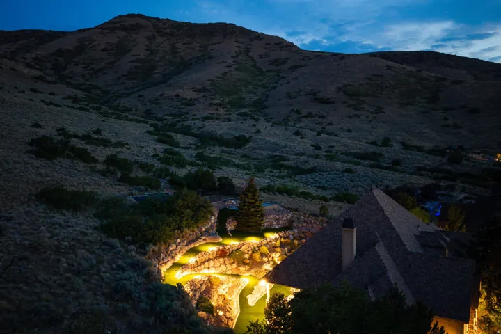 Terraced rock landscaping with integrated accent lighting