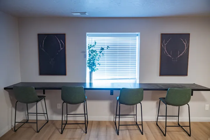 Integrated wall-mounted counter space with a window feature and light wood-finish flooring