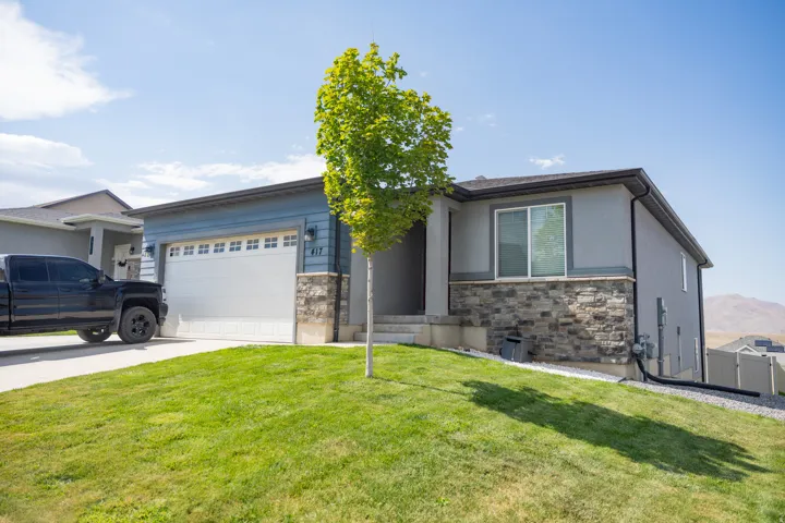 Contemporary exterior featuring light blue siding and gray stucco