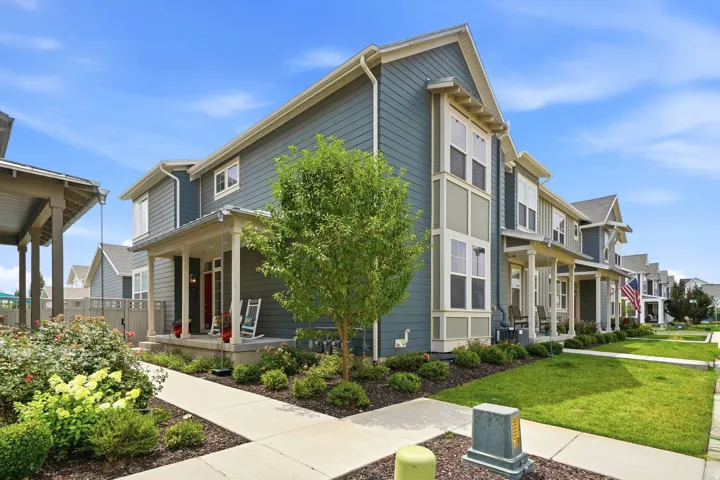 Two-story residential structure featuring blue siding and white trim